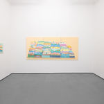 White gallery walls with paintings by Danym Kwon including a large triptych
