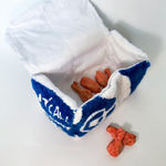 Thomas Martinez Pilnik - a yarn sculpture of a box from Chicken Cottage with a set of 6 glazed terracotta chicken wings