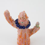 Jen Dwyer sculpture - coral cactus with blue beaded necklace and one eyeball at center