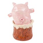 Katie Kimmel's ceramic sculpture of a piglet popping out of a wood tree trunk