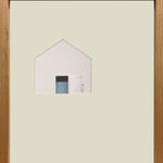 Framed paper cut out of a house with a little creature standing behind an open door