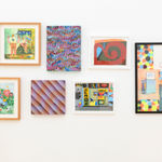 various paintings hanging on the walls at Friends & Family