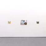 White gallery walls with paintings of various sizes by Angela Burson