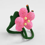 Pink flower sculpture supported by green stems