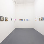 white gallery walls with small artworks
