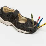 Didi Rojas sculpture of Nike Tabi with crayons