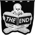 embroidered black and white banner of a skeleton sitting cross legged reading a book