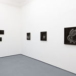 greyscale paintings by Angela Fang Zirbes on white gallery walls