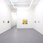 White gallery walls with paintings of various sizes by Angela Burson