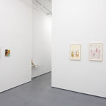 white gallery walls with paintnigs of various sized by Allie Gattor and Natalie Terenzini