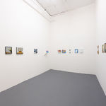 white gallery walls with small assorted artworks