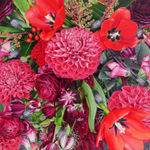 Highly detailed and realistic oil painting on panel of a zoomed in birds eye view of a bouquet of vibrant red and pink flowers Crawling up the stems of the flowers are several Spotted Lantern Flies an insect indigenious to China but has now spread invasively into Japan South Korea and the United States