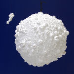 Floating moon composed of molds of lips with floating figure of astronaut composed of casts of fingers.