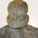 Rounded topper of stone sculpture.