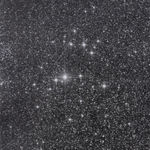 Multiple silkscreen layers of black and white paint construct a blurry and highly pixelated abstract view of a starry night sky