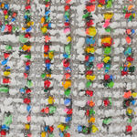 Detail; white and multicolored, neon paint protrusions.