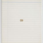 A small wood numeral 8 turned on its side mounted on a sheet of drawing paper as though it is impersonating the infinity symbol.