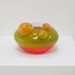 View of the sculpture on a white pedestal.