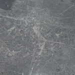 Detail of a clear convex disk with etchings.