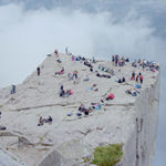 Hikers on clif at Preikestolen (Pulpit Rock), Norway by Massimo Vitali