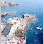Massimo Vitali elevated vantage photograph of sunbathers on dock and in water
