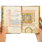 A richly illuminated medieval manuscript, Italian Book of Hours from Rome, signed and dated by the scribe, with many illuminations and decorative borders, with the page showing the Annunciation
