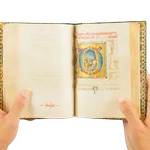 A richly illuminated medieval manuscript, Italian Book of Hours from Rome, signed and dated by the scribe, with many illuminations and decorative borders, with the page showing Saint Jerome praying