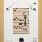 Verso view of a 20th-century Spanish Forger manuscript leaf, showing original Latin text on 15th-century parchment, musical notation, framed with gallery labels from La Gabrielle Fine Arts SA, Geneva, Switzerland.