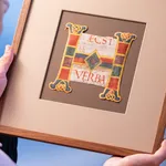 A large and richly illuminated initial H from an Atlantic Bible, Rome, Italy, c. 1100, with intricate ornaments and various decorations in blue, yellow, green and blue.