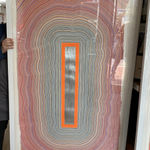 Orange Window shown with custom frame ready for client's home.