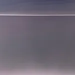 abstract work made of horizontally aligned segments in desaturated tones of green and purple