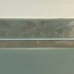 abstract work made of horizontally aligned segments in desaturated tones of green