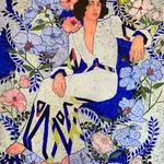 Nikoleta Sekulovic, elegant seated woman adorning a patterned dress surrounded by flowers