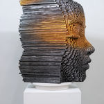 "Mind Bending" a sculpture of a face made from wooden sticks and paint by slate gray gallery artist Gil Bruvel