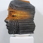 "Mind Bending" a sculpture of a face made from wooden sticks and paint by slate gray gallery artist Gil Bruvel