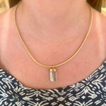Aquamarine Crystal and 22k gold pendant by Fringe Gallery studio jeweler Marki Knopp