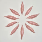 Pink Ceramic petals that can be arranged in multiple ways by slate gray gallery artist Angela Okajima-Kempinas