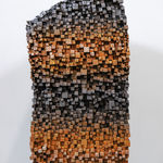 "Mind Bending" a sculpture of a face made from wooden sticks and paint by slate gray gallery artist Gil Bruvel