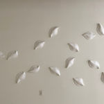 Ceramic petals that can be arranged in multiple ways by slate gray gallery artist Angela Okajima-Kempinas