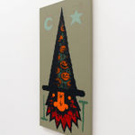 Painting of a GATS character with a tall witch hat with pumpkins on it and a red beard on green background