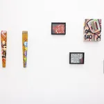 white gallery wall with a mixture of colorful pieces by Chris RWK