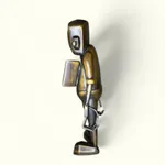 left side view of a bronze robot statue with an open door on his chest revealing a heart