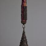 detail of the bronze bell attached to the mixed media bat sculpture by Lucien Shapiro