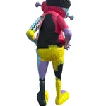 back view of a multi-colored robot statue holding a heart