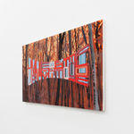 Painting with bare trees in the background on a yellow red sky in the foreground is the words Jumping From Ice Floe to Ice Floe in red and blue