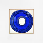 Ted Collier Circle Series painting with blue circle coated in resin on a white canvas hanging on a white wall