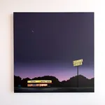 Kristin Moore Moonrise Over Waffle House painting on a white wall featuring a glowing roadside diner at night beneath a deep purple sky with a crescent moon and illuminated Waffle House signage.