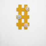 orange criss cross wall sculpture