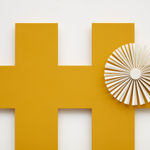 orange criss cross wall sculpture