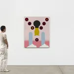 Scale of figure near colorful graphic painting with flowers and clouds against white wall